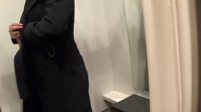 Big-Titted Blonde Fingers Herself in a Public Changing Room