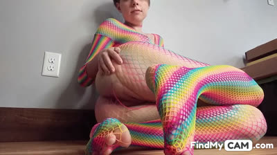 Teen in Rainbow Fishnets Fingers Herself