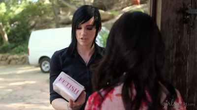 Young girl tries her toy with delivery girl