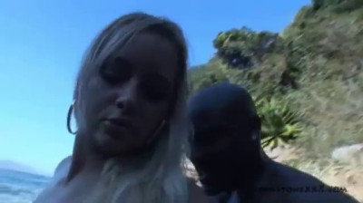 A rich interracial on the seashore